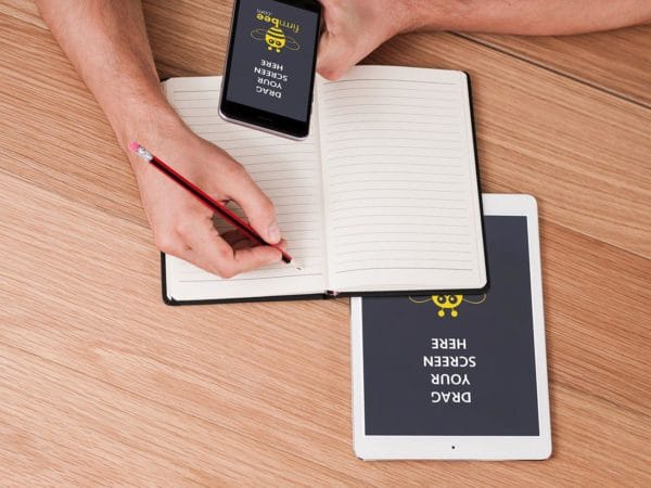 Taking notes and iPhone iPad free mockup