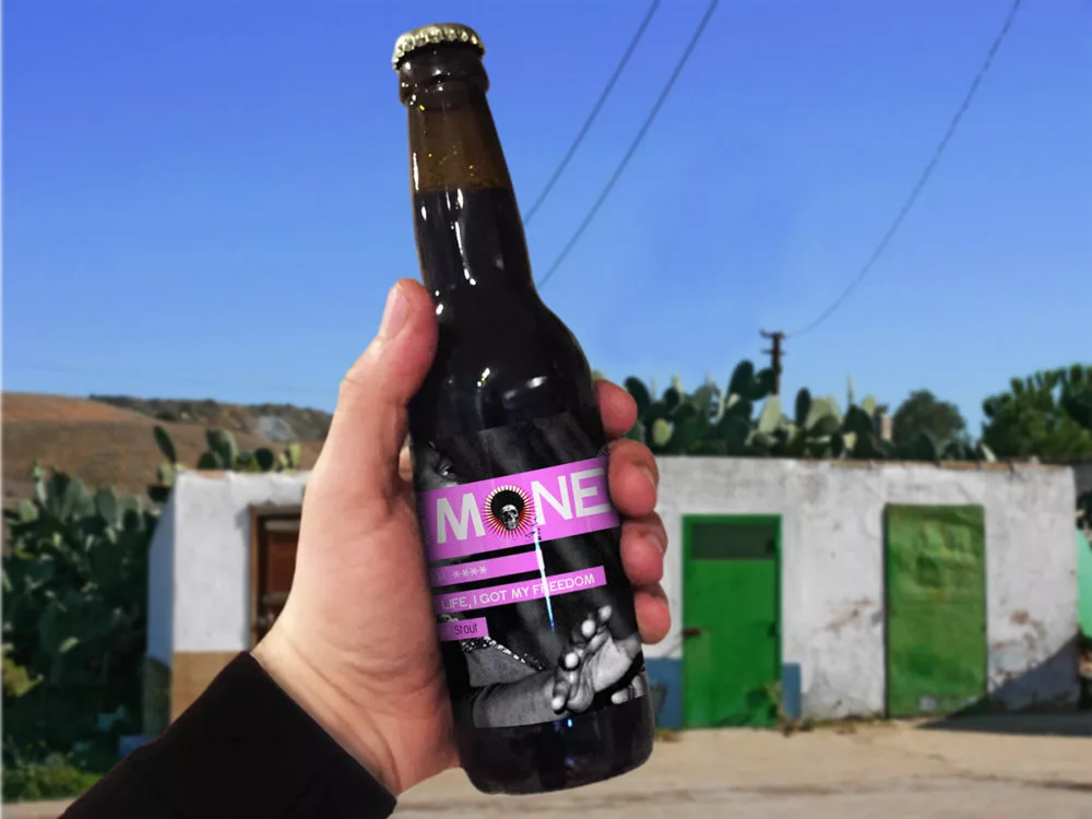 Bottle of Beer in hand – Free PSD Mockup