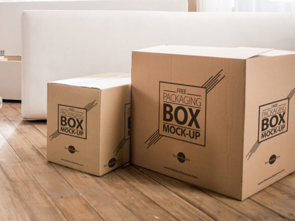 Packaging Box on Wooden Floor Free PSD Mockup