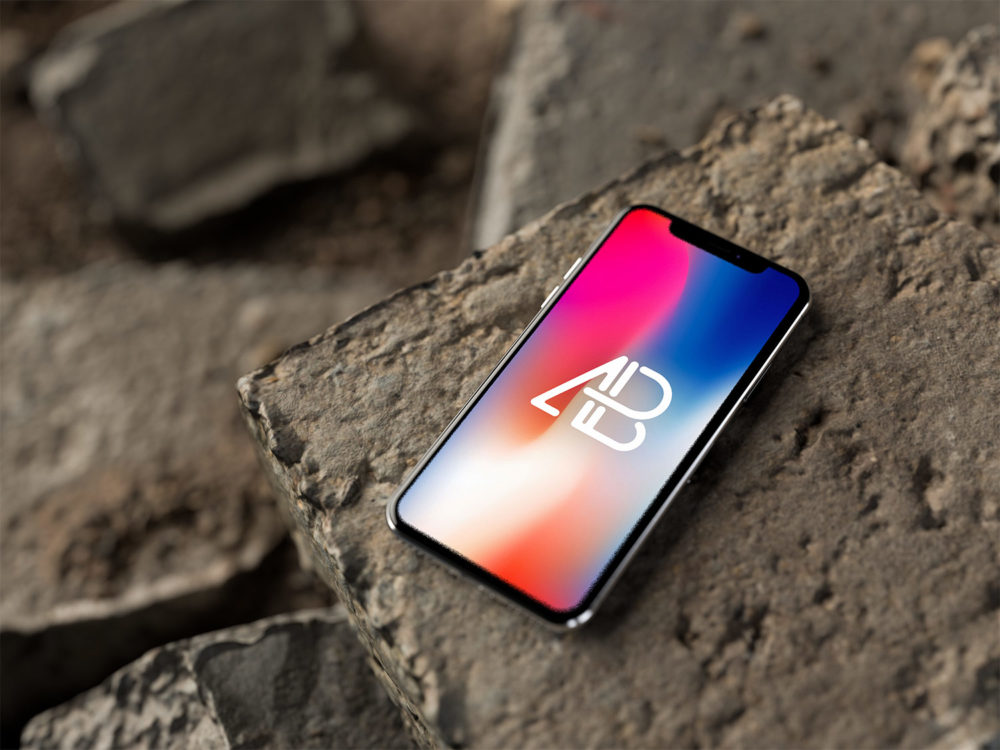 iPhone X on Rocks Free Mockup