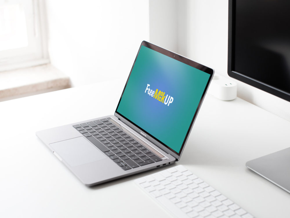 MacBook Pro on Table Free Mockup