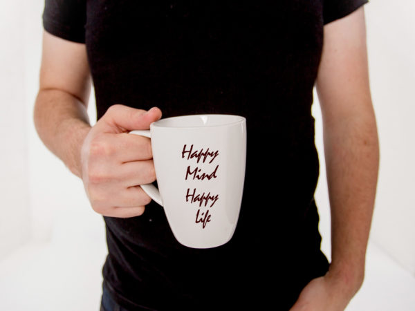 Mug in Hand Free Mockup