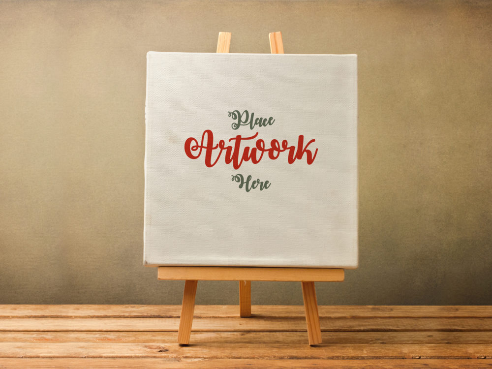 Free Canvas on Wooden Stand Mockup