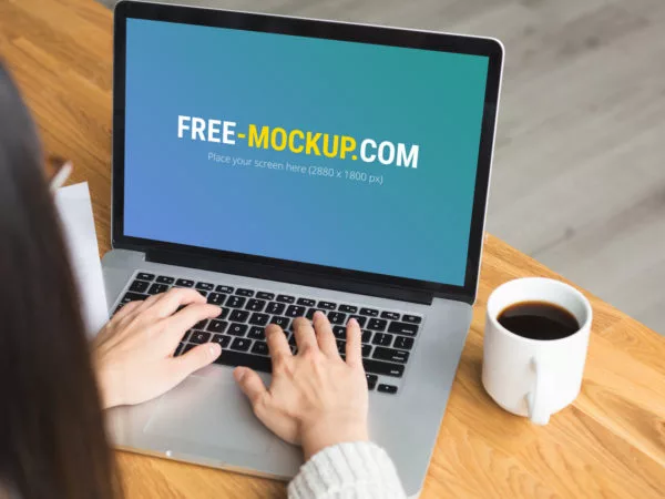 Woman Working on a MacBook Pro Mockup