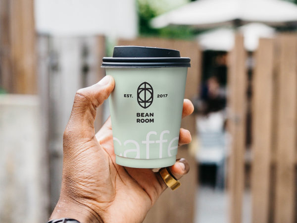 Hand Holding Coffee Cup Mockup