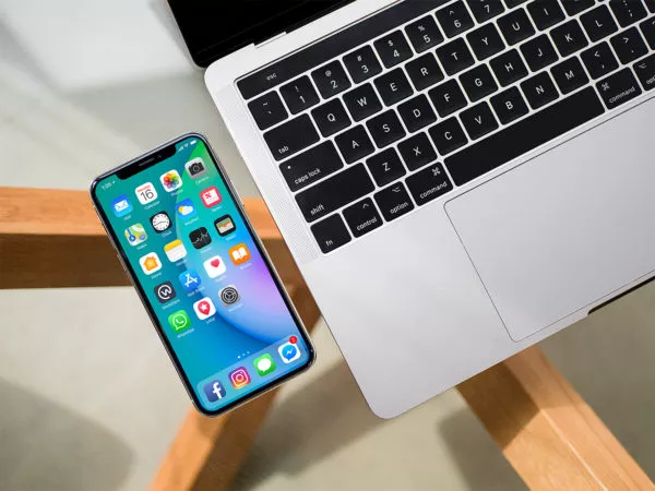 iPhone X Mockup on Glass Table (Top View)