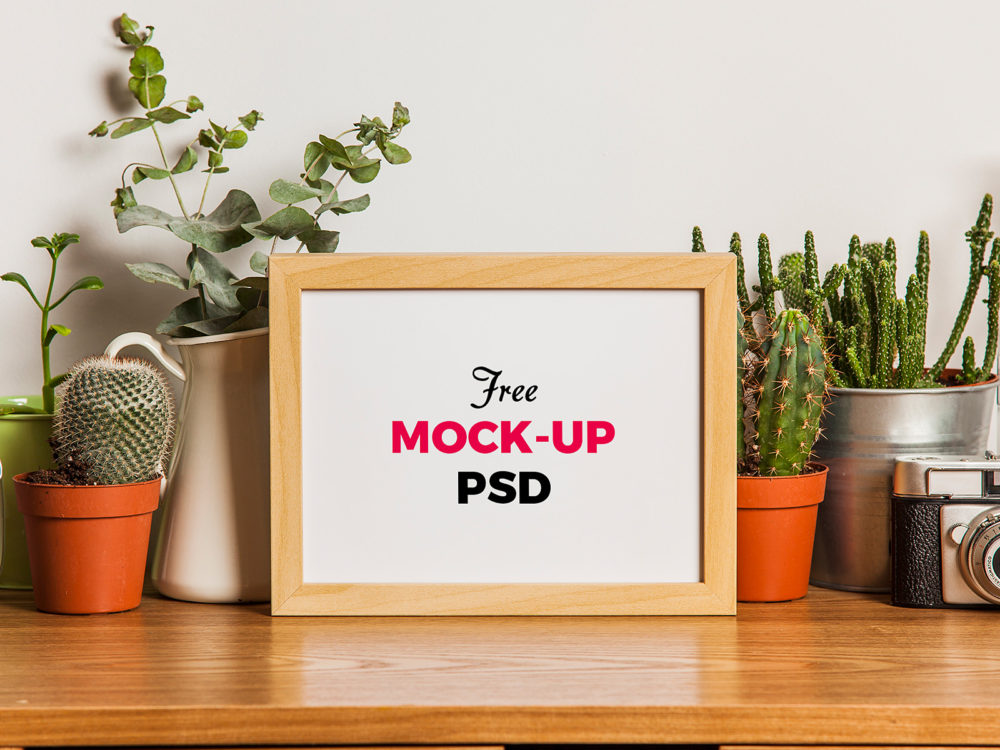 Wood Photo Frame on the Desk Free Mockup