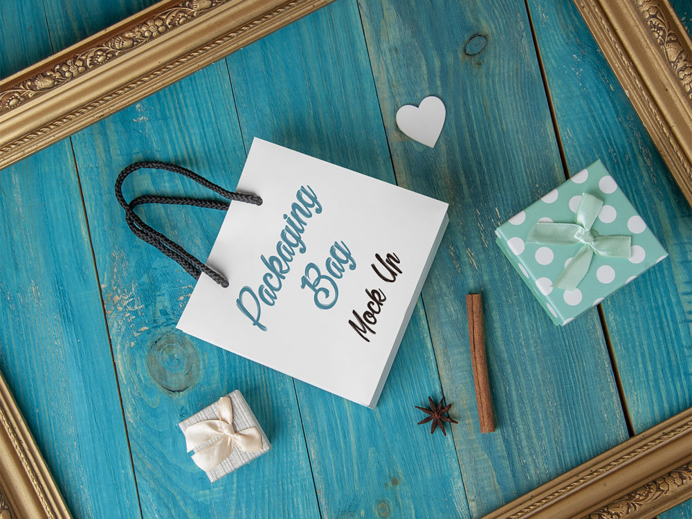 Download Free Gift Bag Mockup on a Blue Wooden Background | Free Mockup