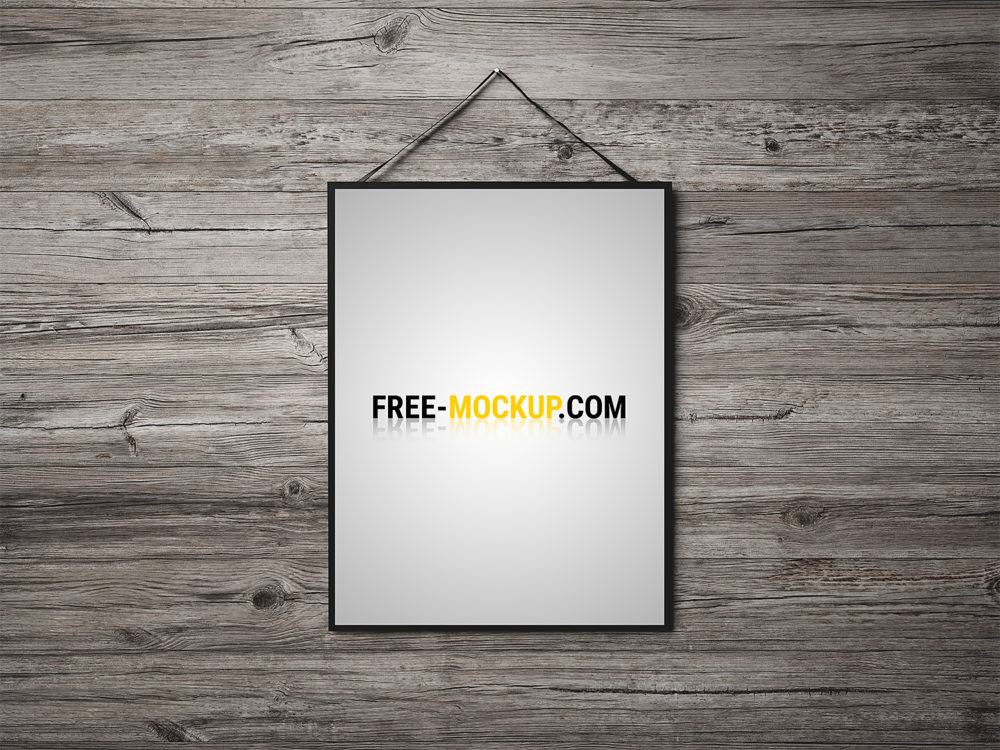 Free Poster Mockup on the Wooden Background