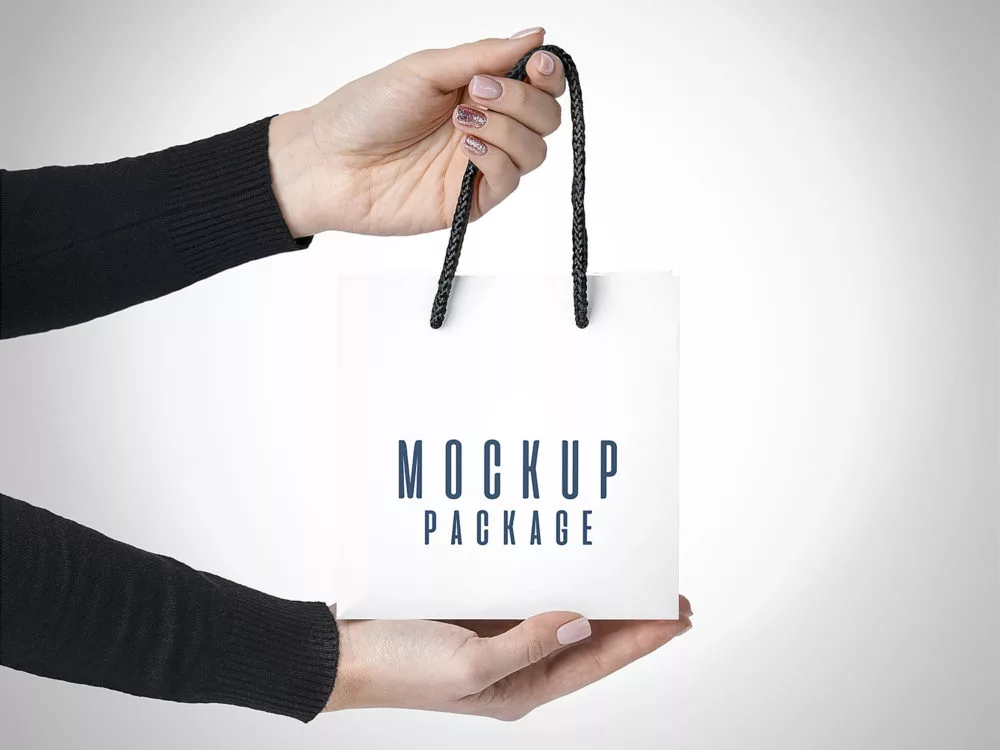 Gift Bags in Hands Free Mockup