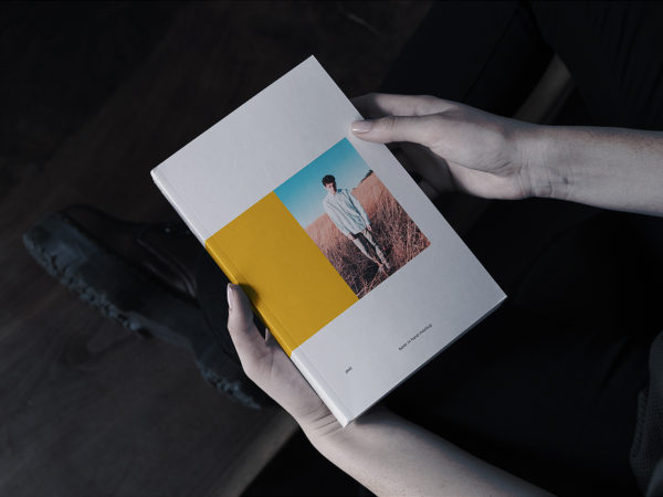 Book in Hand Mockup Free