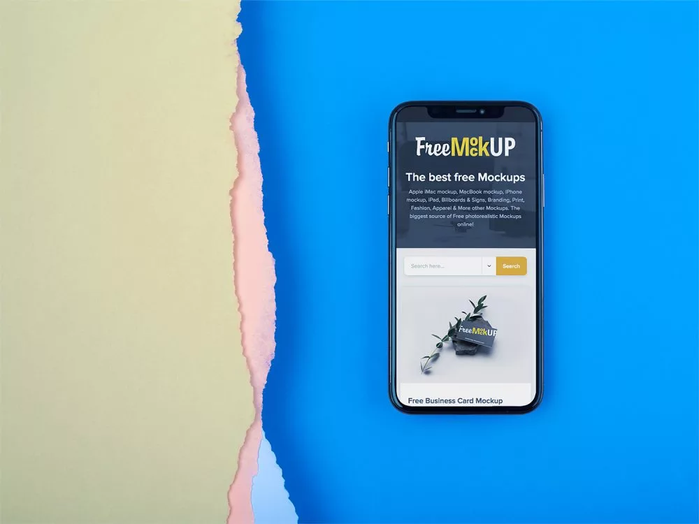 iPhone X Mockup Lying on a Blue Surface Near Broken Paper