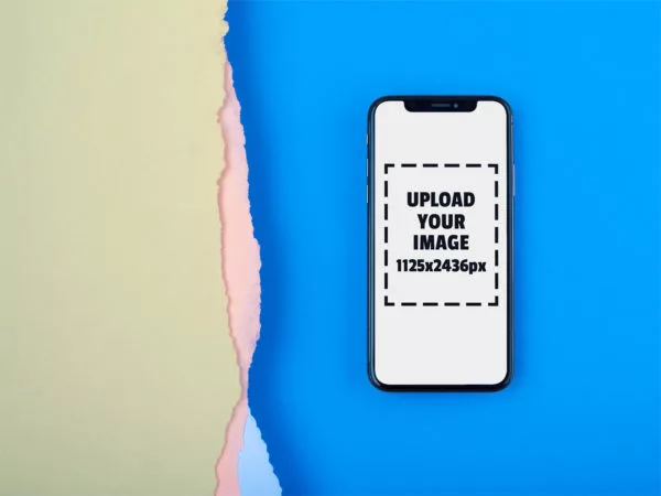 iPhone X Mockup Lying on a Blue Surface Near Broken Paper