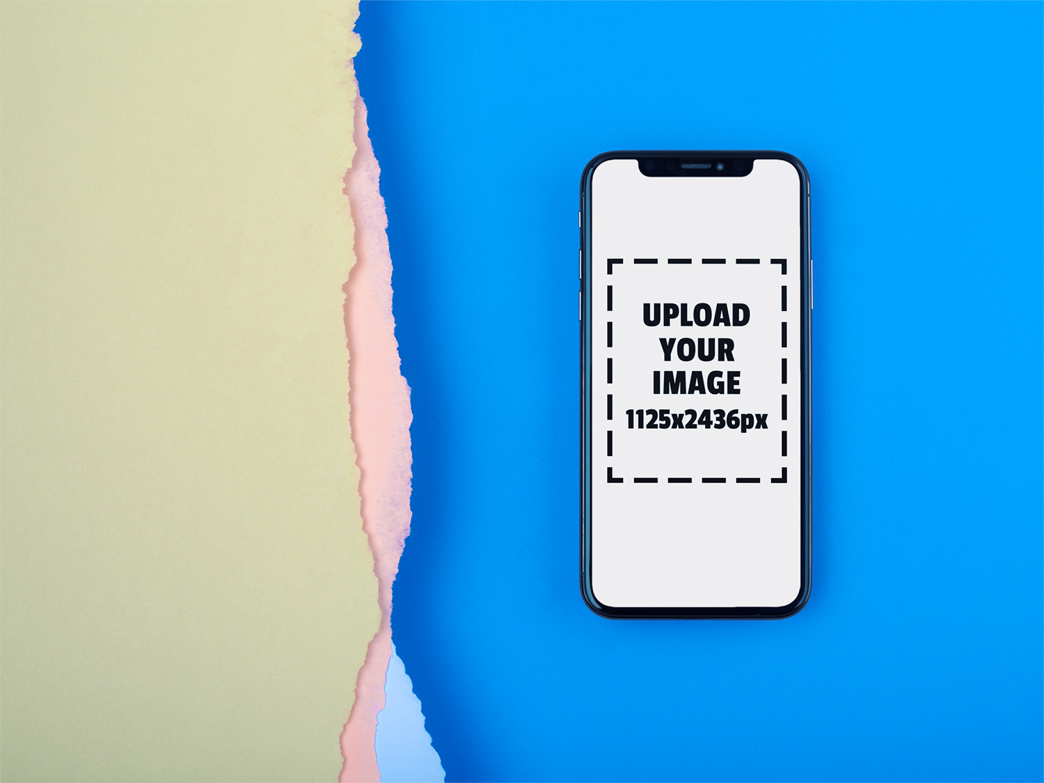 iphone-x-mockup-lying-on-a-blue-surface-near-broken-paper-a20011