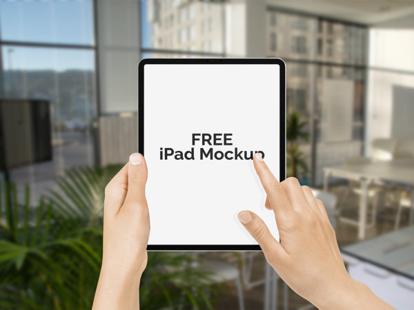 Free New iPad Pro in Hand Mockup