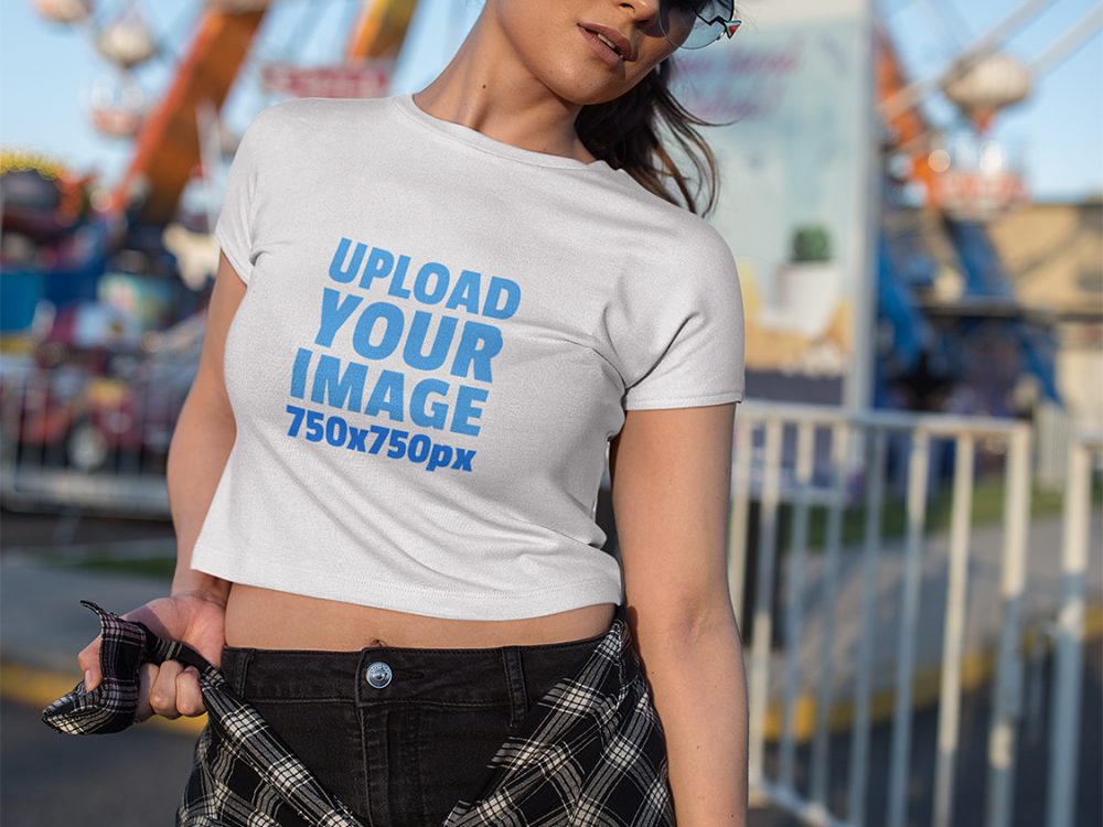 woman wearing a crop top t shirt mockup at an amusement park