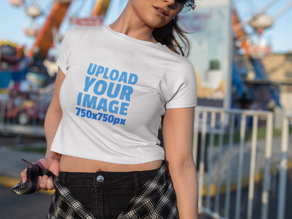 Woman Wearing a Crop Top T-Shirt Mockup at an Amusement Park