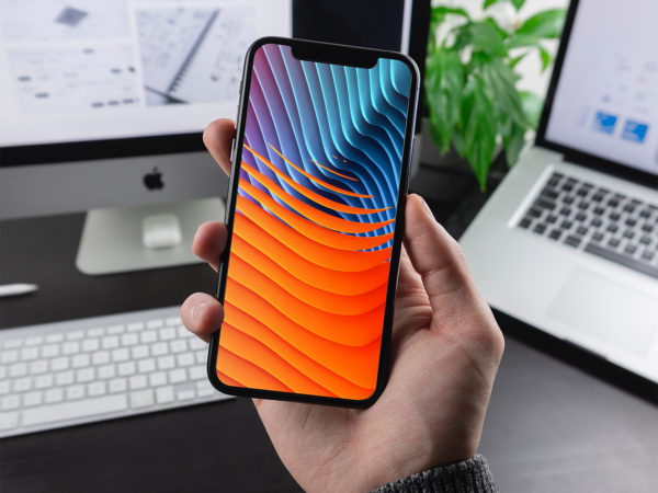 Man Holding iPhone X / XR / XS Mockup