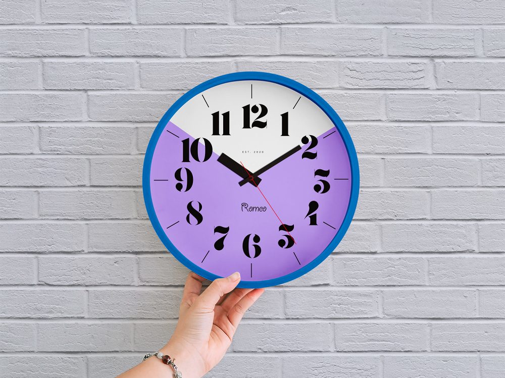 Free Wall Clock in Hand Mockup PSD