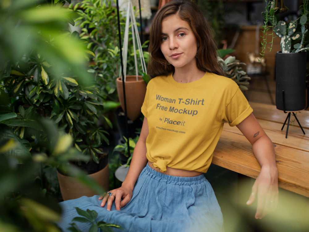 Download T Shirt Mockup Of A Woman Relaxing In Her Garden Free Mockup