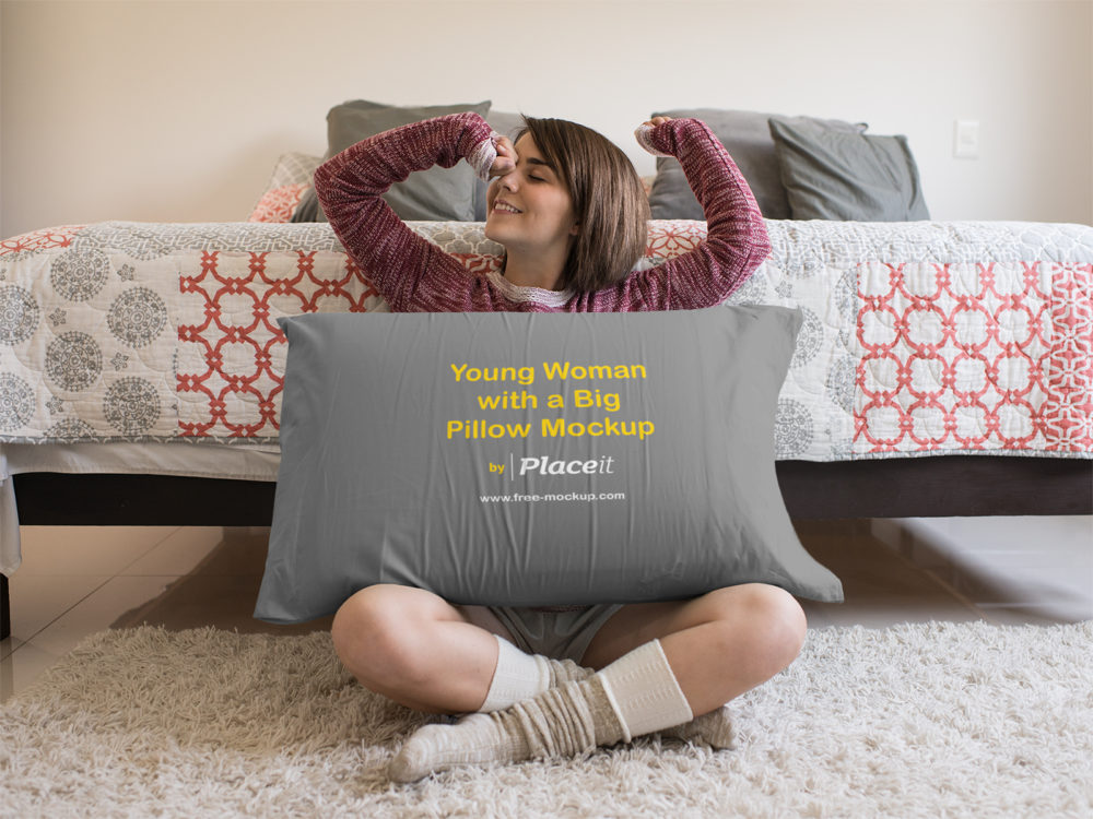 Young woman sitting down with a big pillow mockup | free mockup