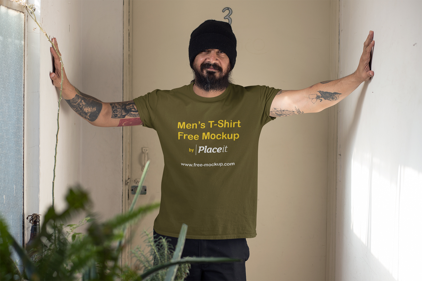 Download Mockup of a Tattooed Man Wearing a T-Shirt Indoors | Free ...