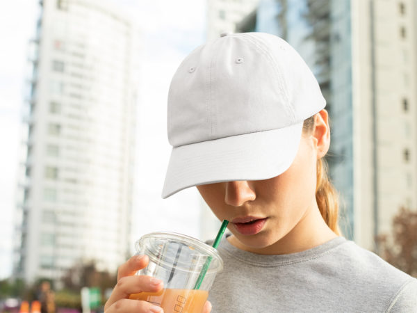 Dad Hat Mockup of a Woman with a Beverage