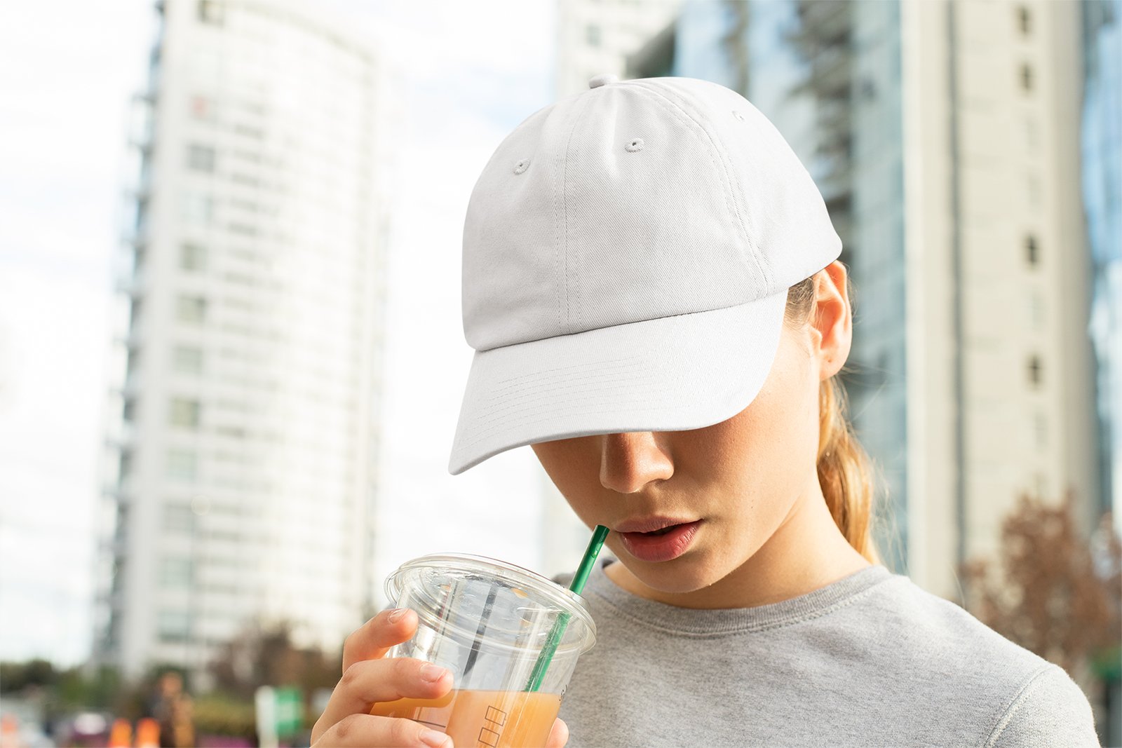 Download Dad Hat Mockup of a Woman with a Beverage | Free Mockup