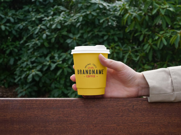 Hand Holding Coffee Cup PSD Mockup