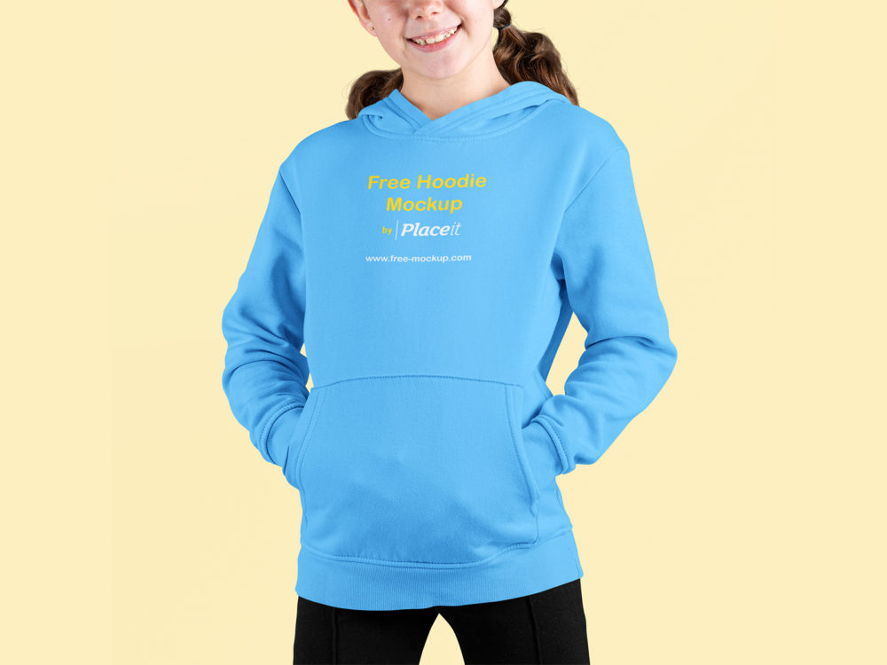 Smiling girl wearing a pullover hoodie mockup at a studio front view | free mockup