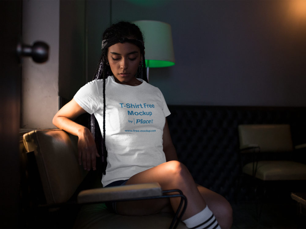 T Shirt Placeit Mockup Featuring a Woman in a Low Lit Room
