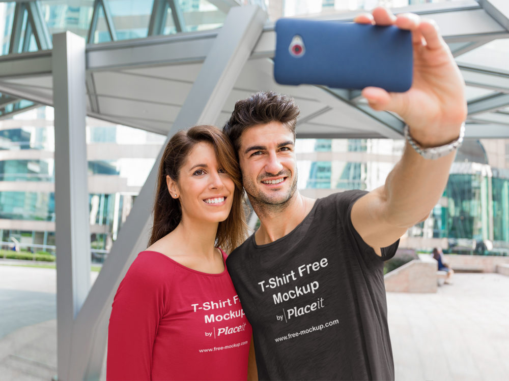Round Neck T-Shirt Mockup of a Couple Taking a Selfie