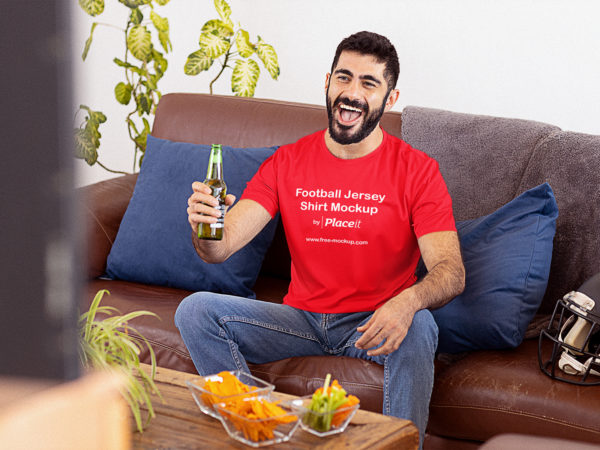 Jersey Shirt Mockup of a Football Fan Watching the Big Game at Home