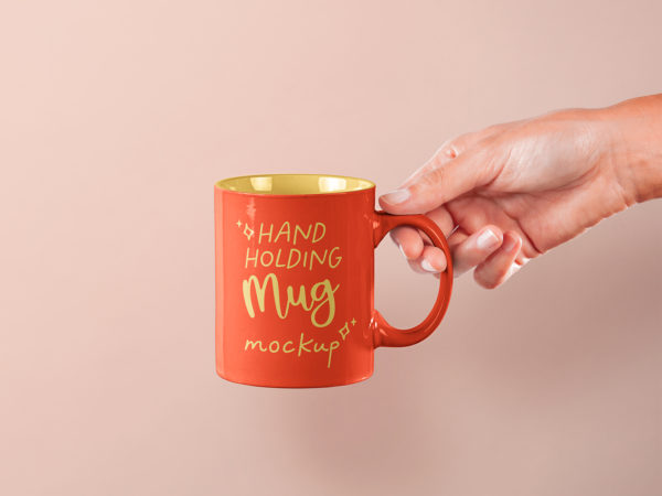 Hand Holding Mug Free PSD Mockup