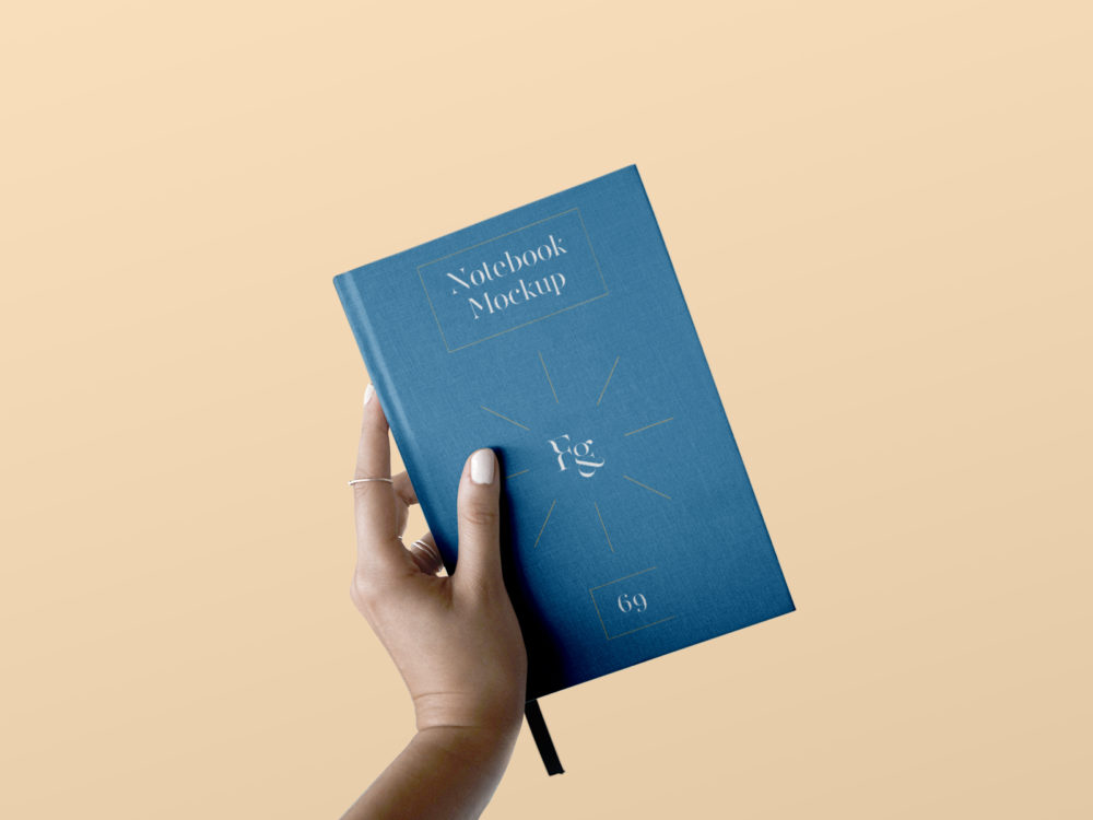 Hard cover notebook free mockup in hand | free mockup