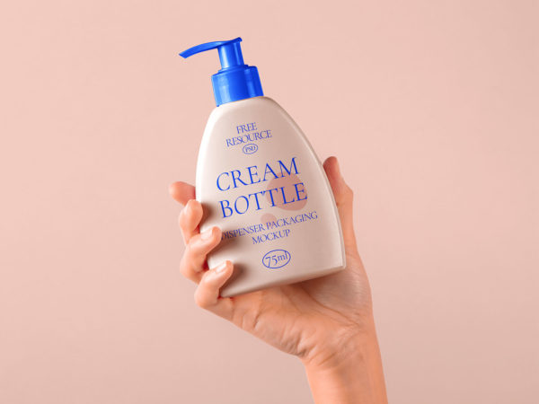 Hand Holding Cosmetic Pump Bottle Mockup PSD