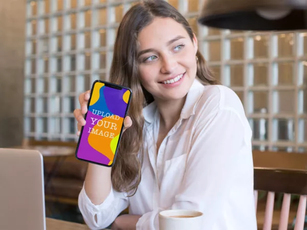 iPhone Mockup in Hand of a Smiling Girl