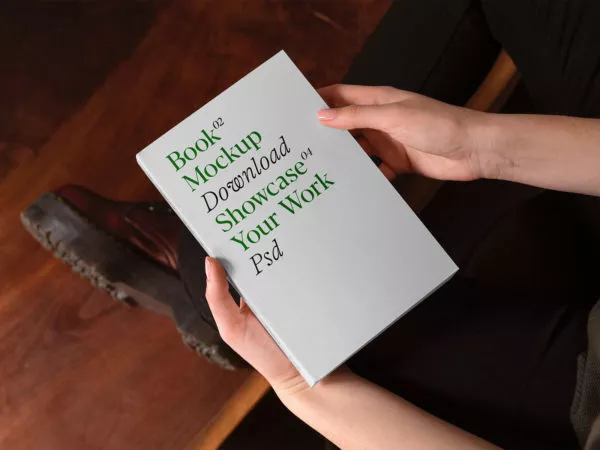 Hardcover Book in Hands Mockup