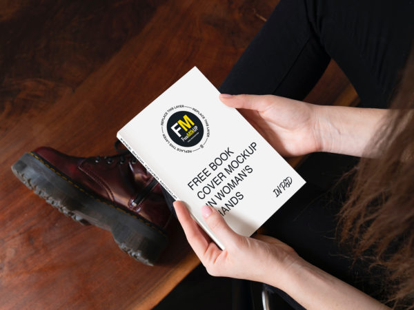 Free Book Cover Mockup in Woman's Hands