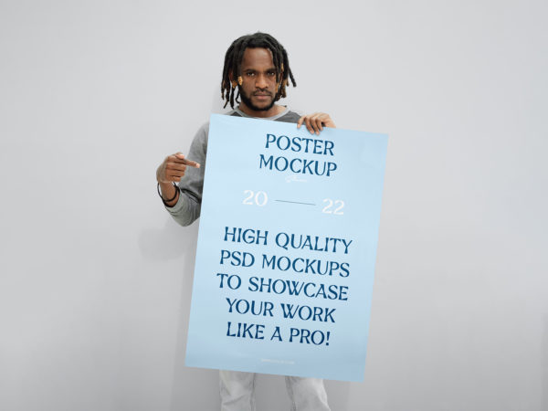 Man Holding a Huge Poster Mockup Free