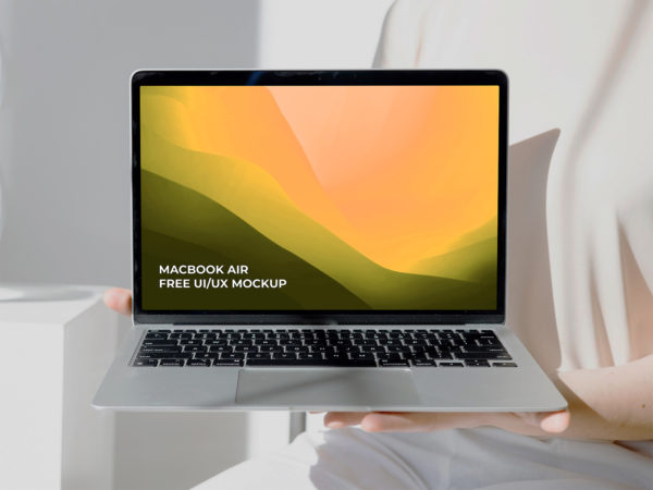 Women’s Hands Holding MacBook Air Mockup