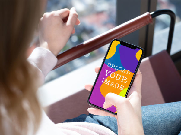 Woman Holding iPhone Mockup: Craft Your Unique Presentation Online!