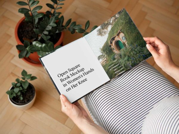Open Square Book Mockup Held by Woman