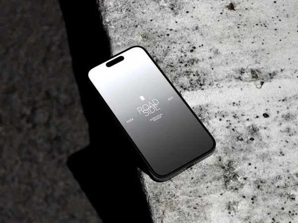 iPhone 15 Pro Mockup Lying on Concrete Surface