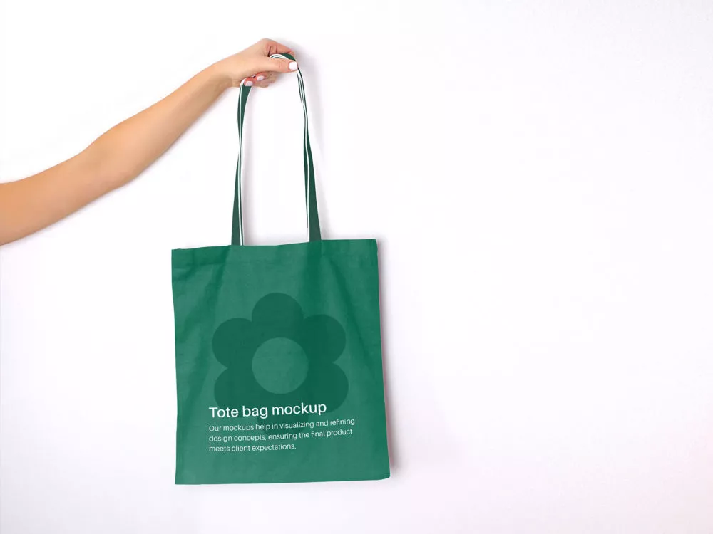 Hand holding tote bag mockup