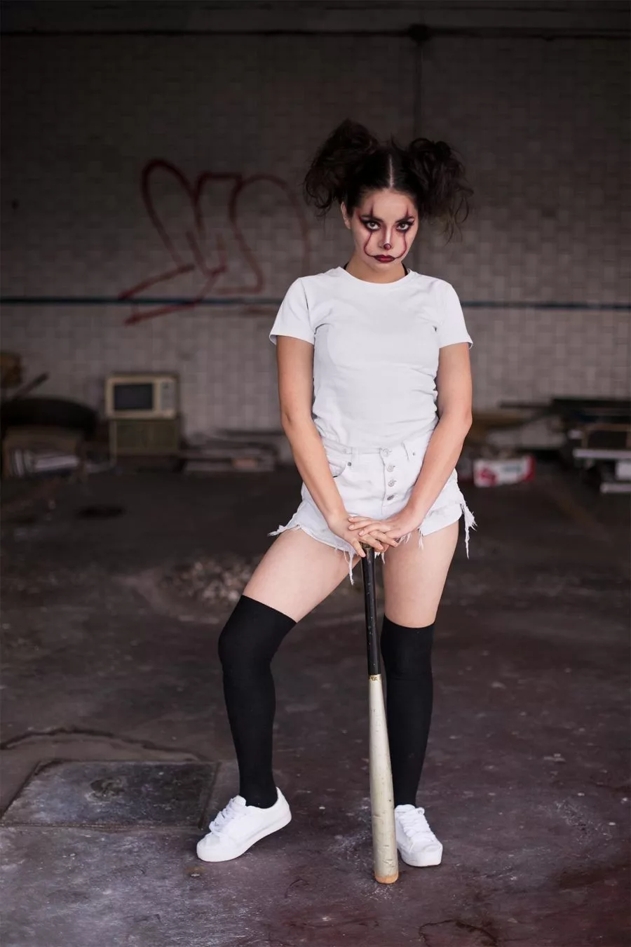 Halloween T-shirt Mockup of a Woman in Clown Makeup