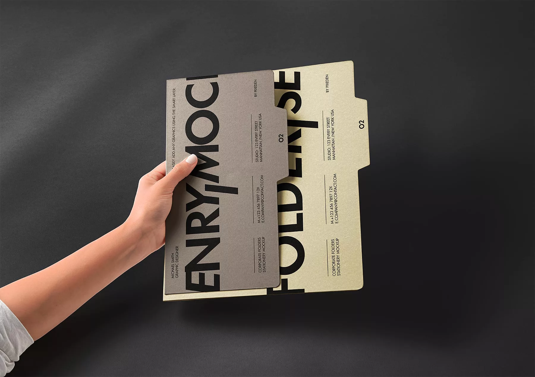 Hand Holding Stationery Folder Mockups