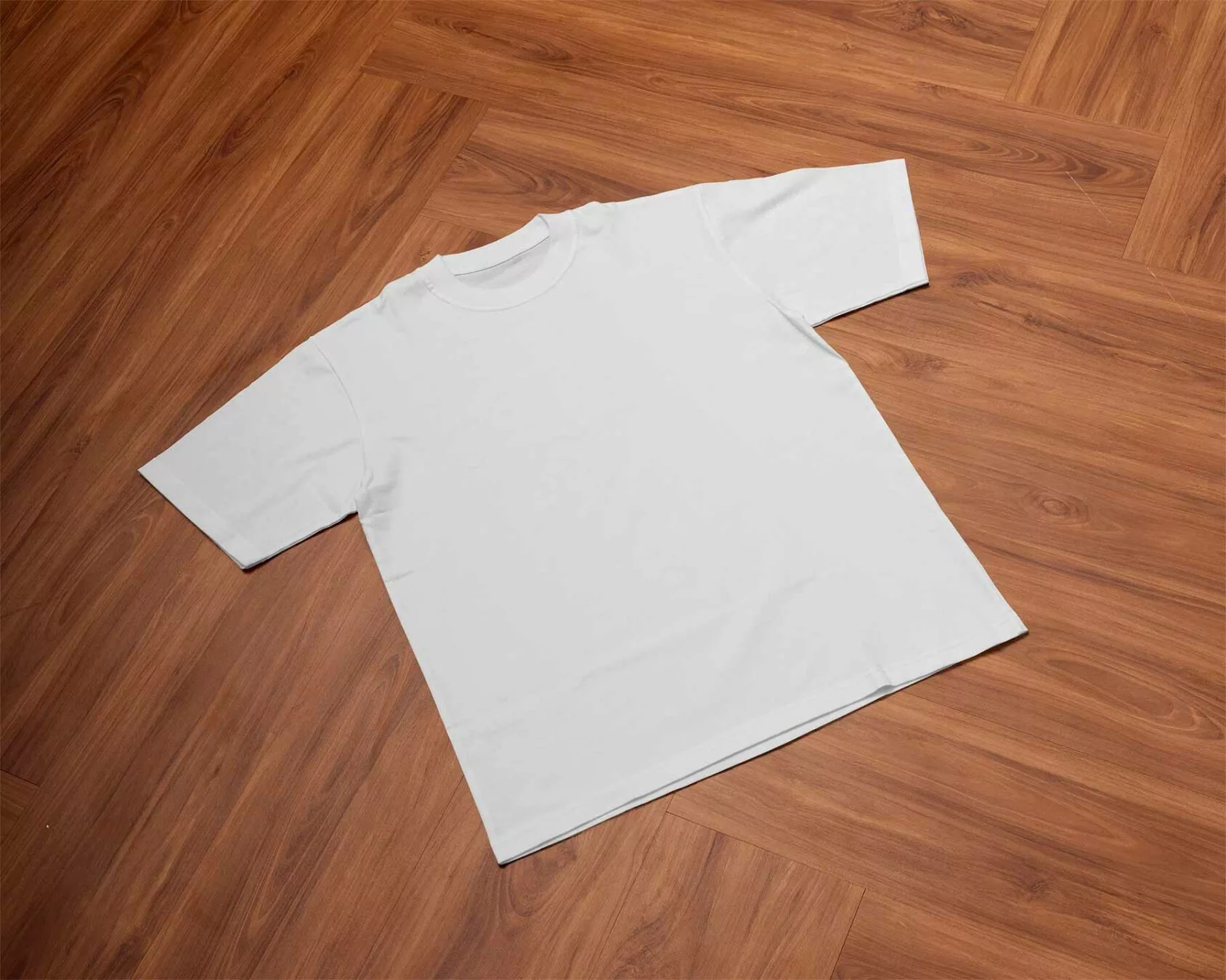 T-shirt Free Mockup on a Wooden Floor