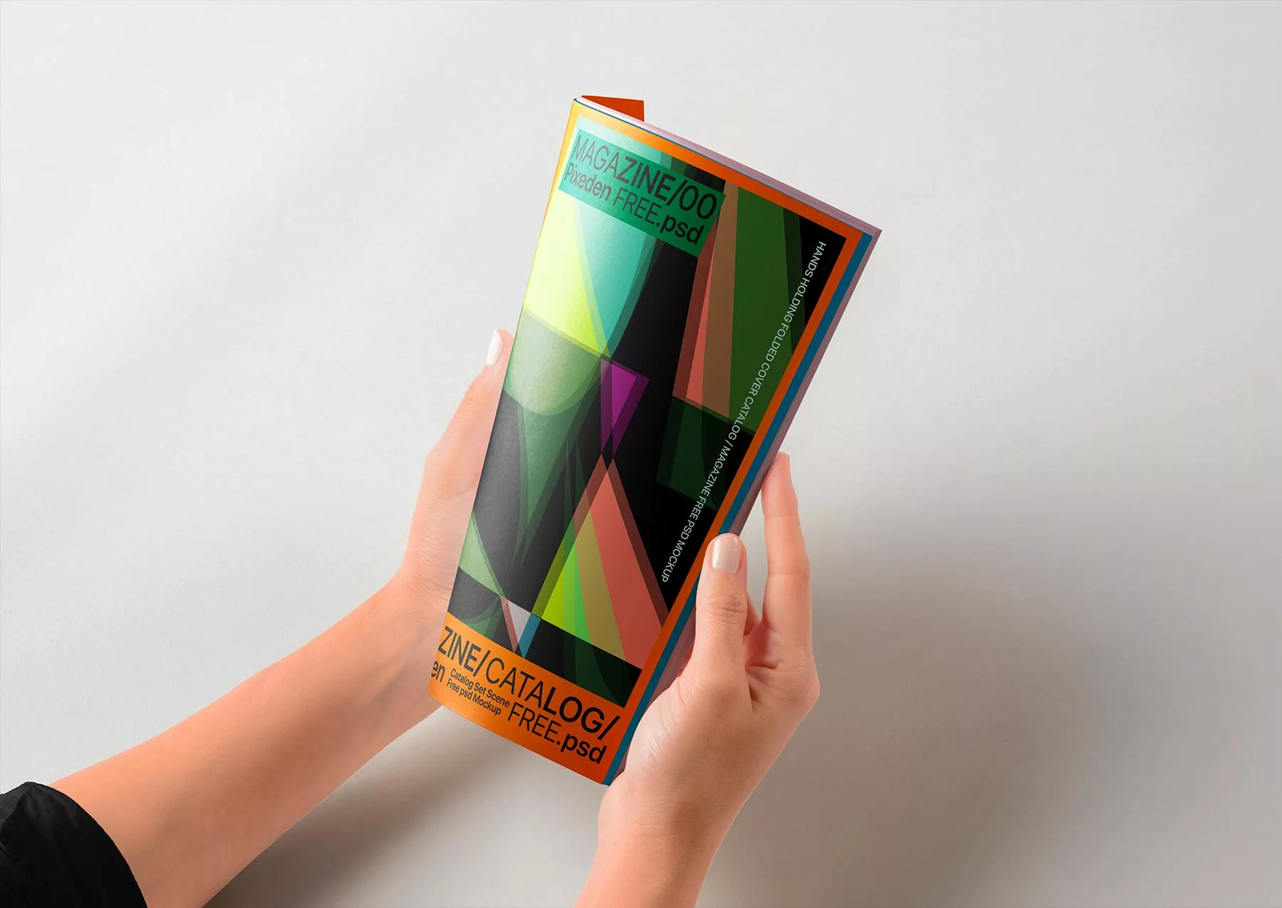 Hands Holding Folded Magazine Mockup