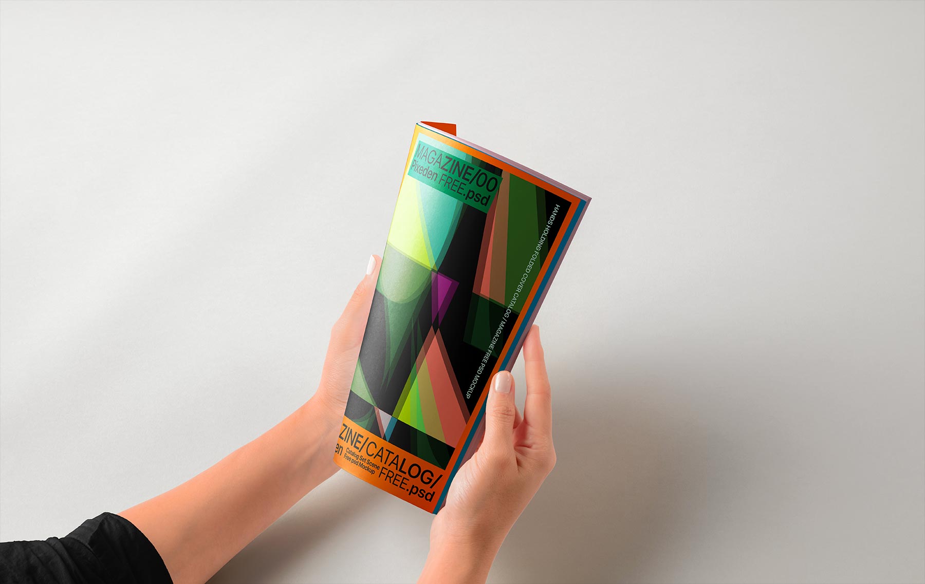 Hands Holding Folded Magazine Mockup